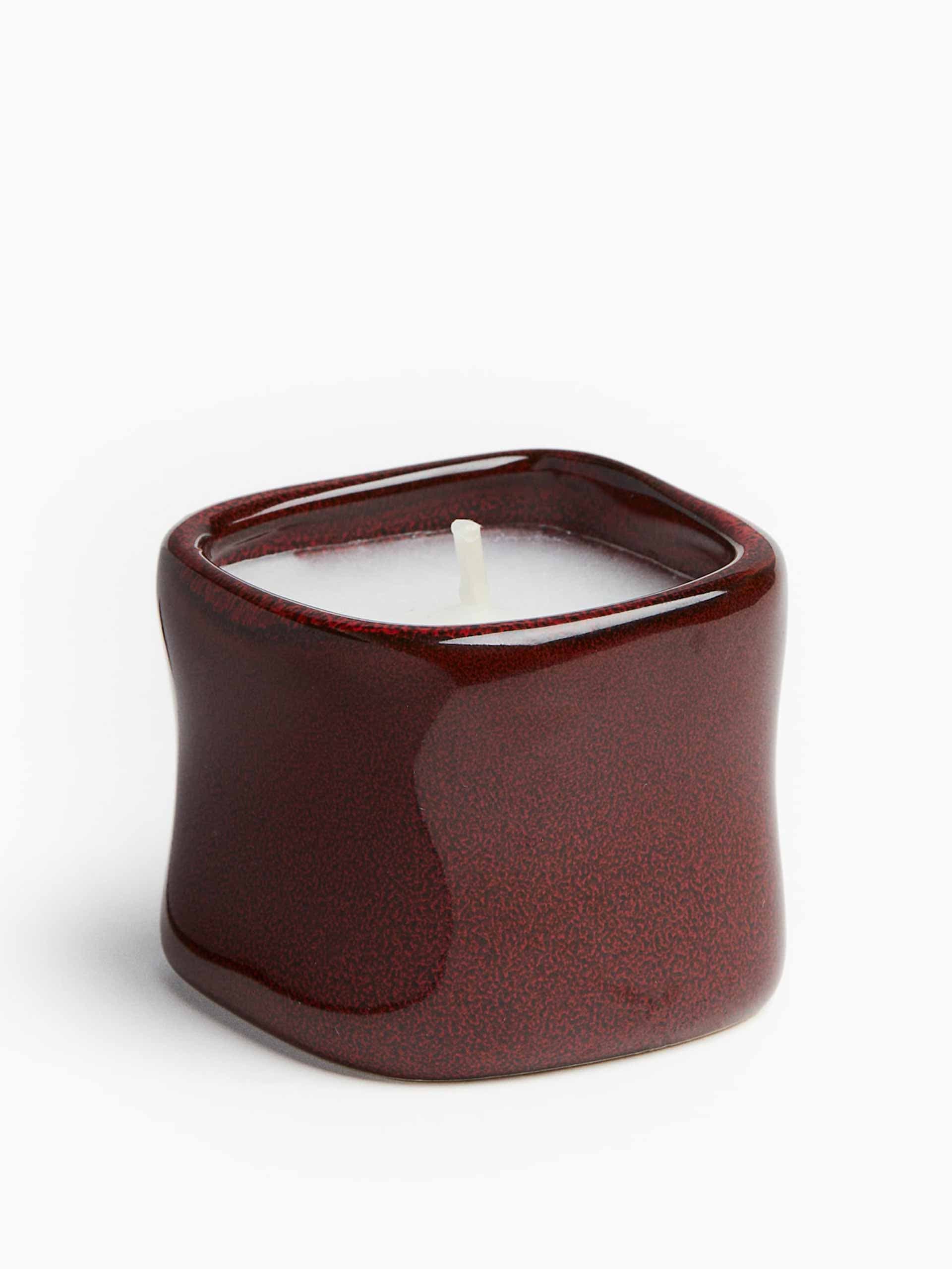 Scented candle in a ceramic holder