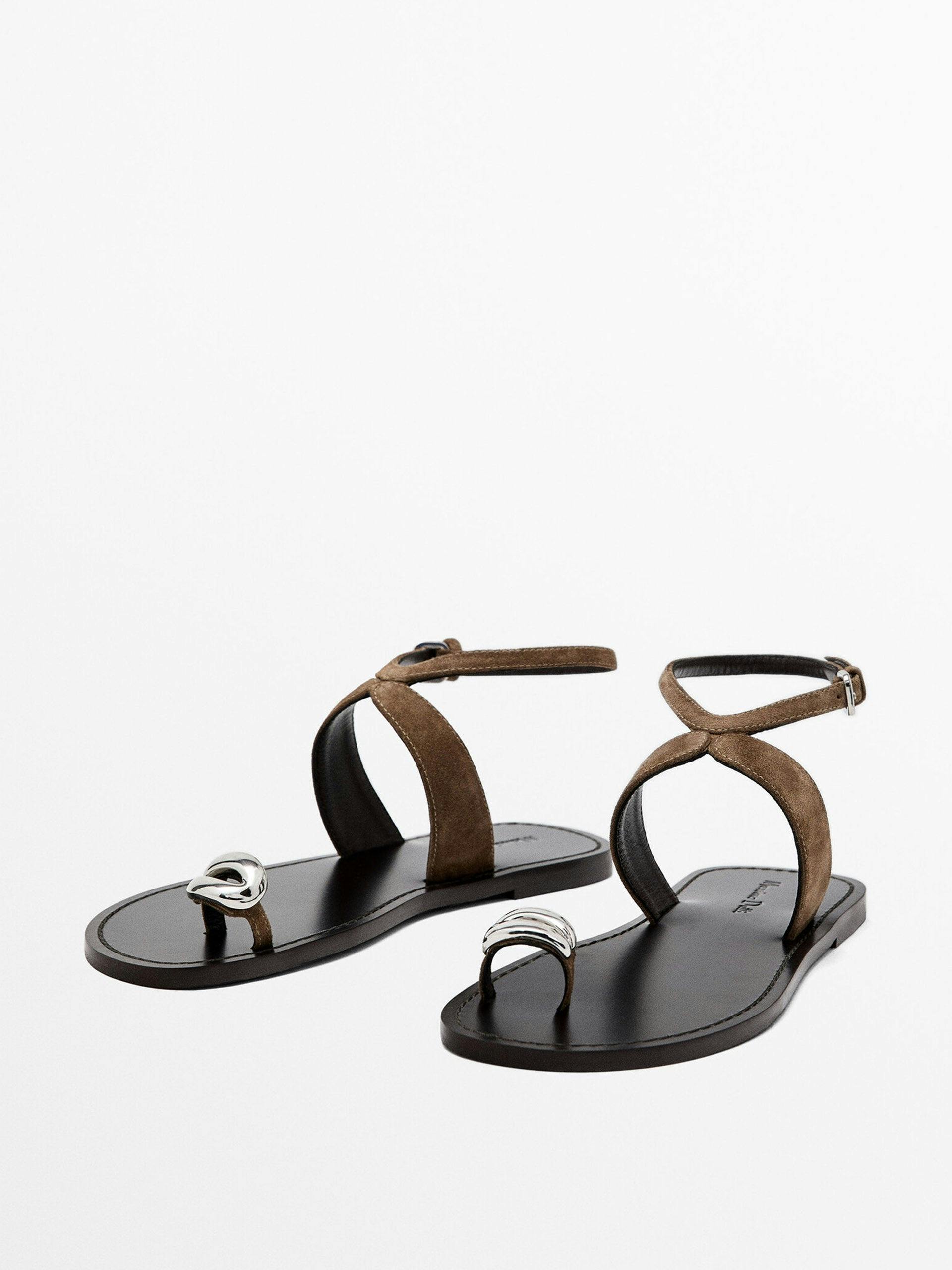 Flat sandals with metallic embellishment