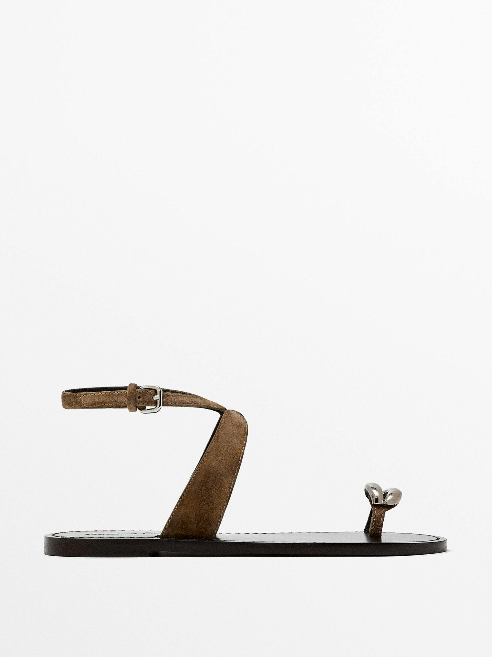 Flat sandals with metallic embellishment