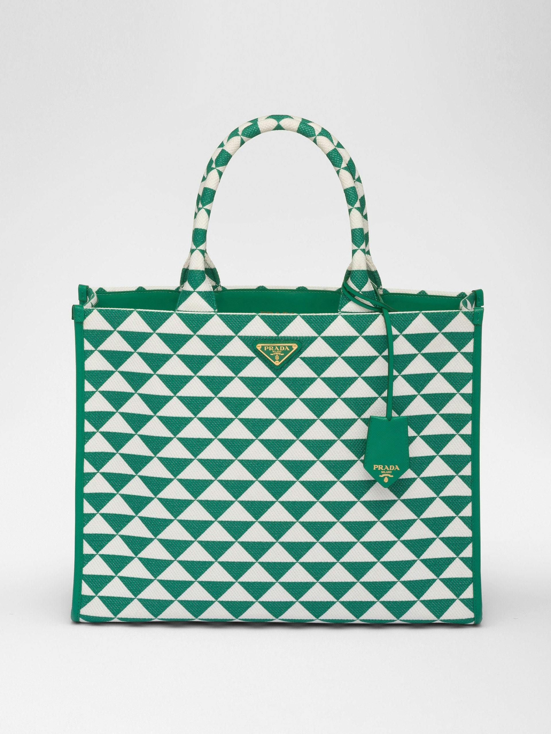 Green and white embroidered fabric handbag