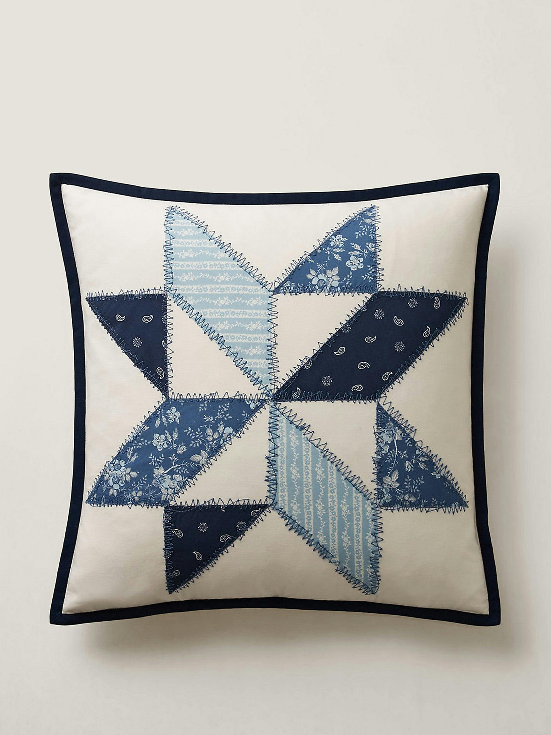 Blue and white throw pillow