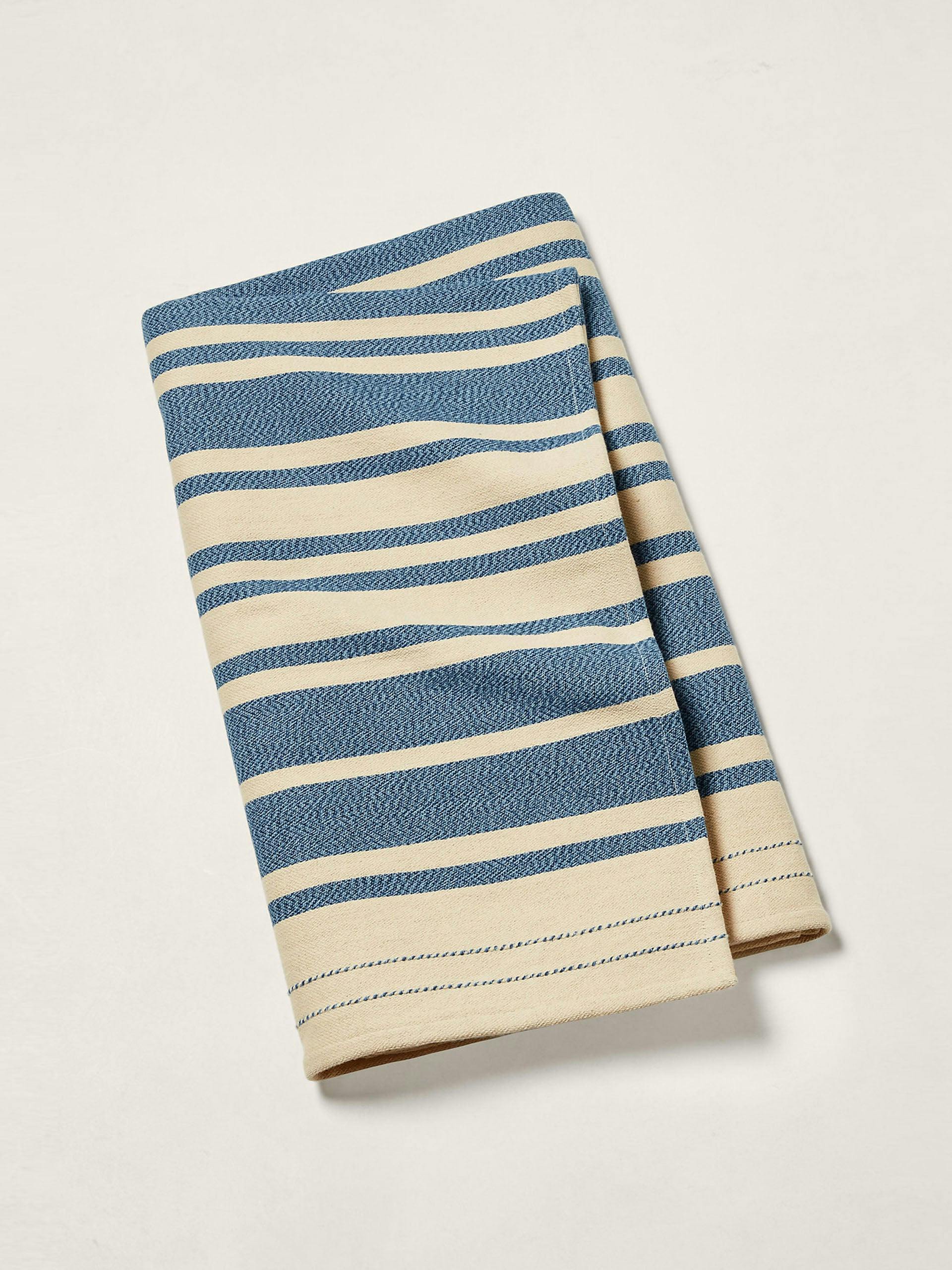 Blue and beige throw blanket