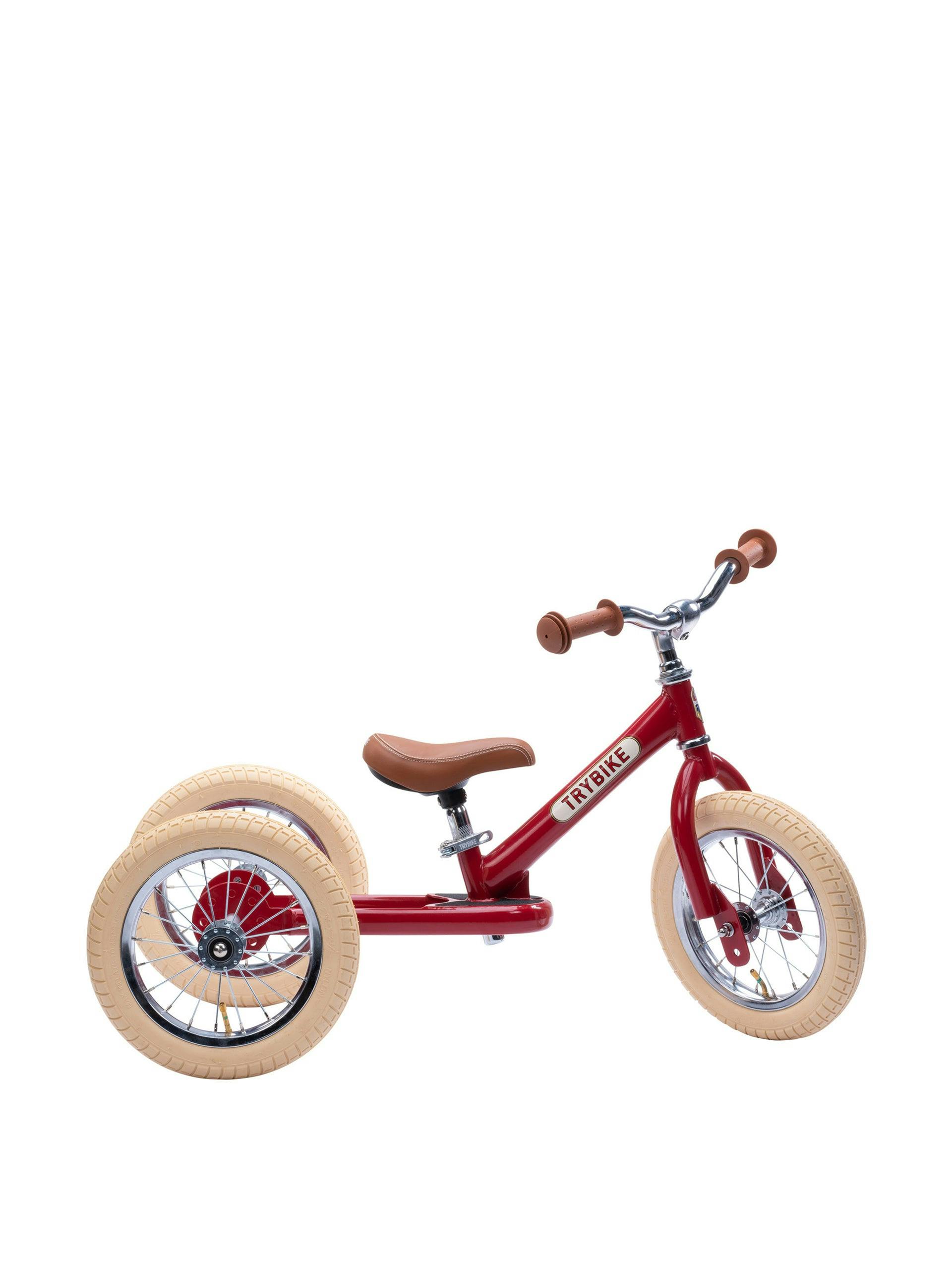 Red tricycle balance bike