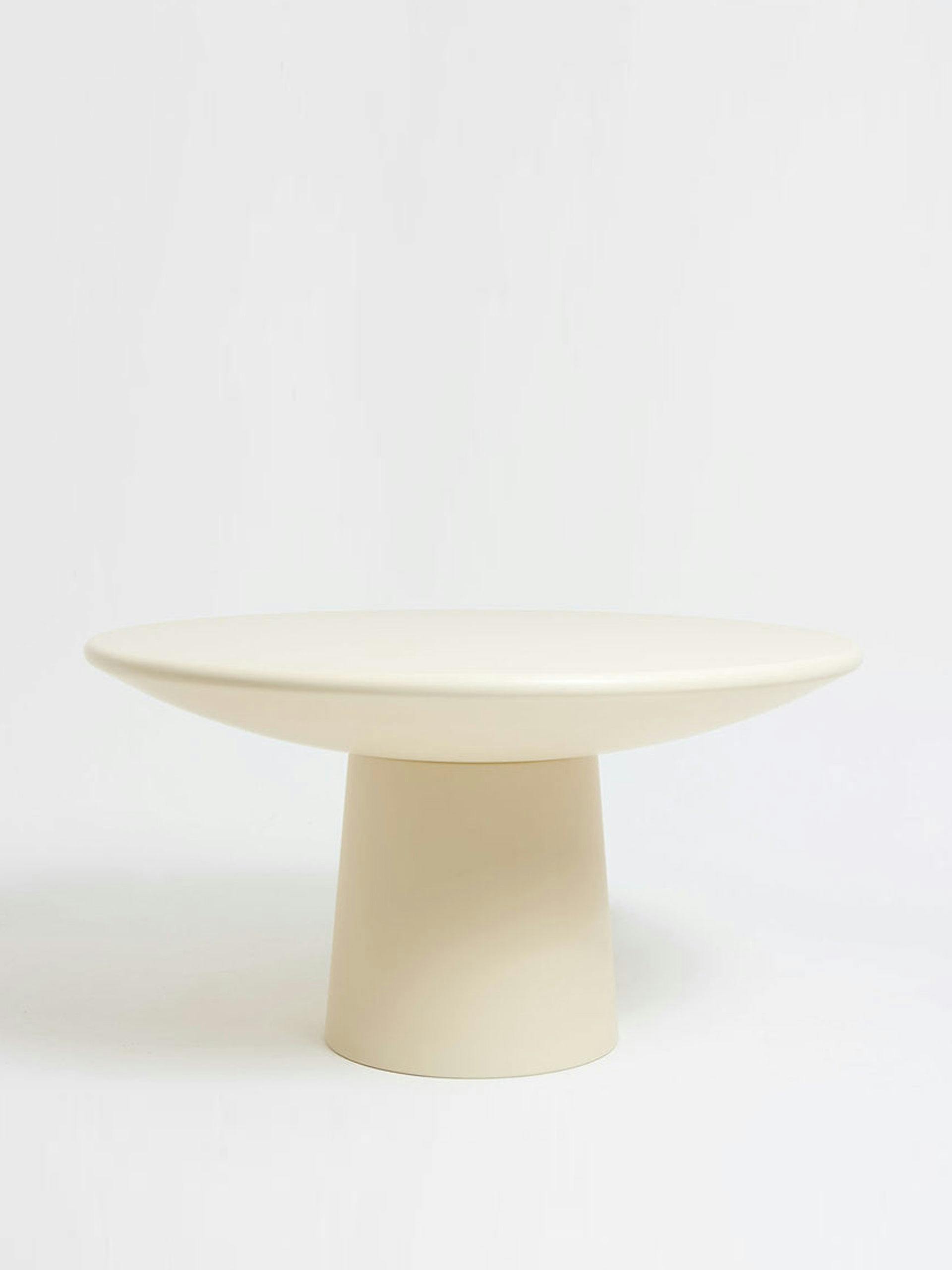 Cream roly-poly dining table