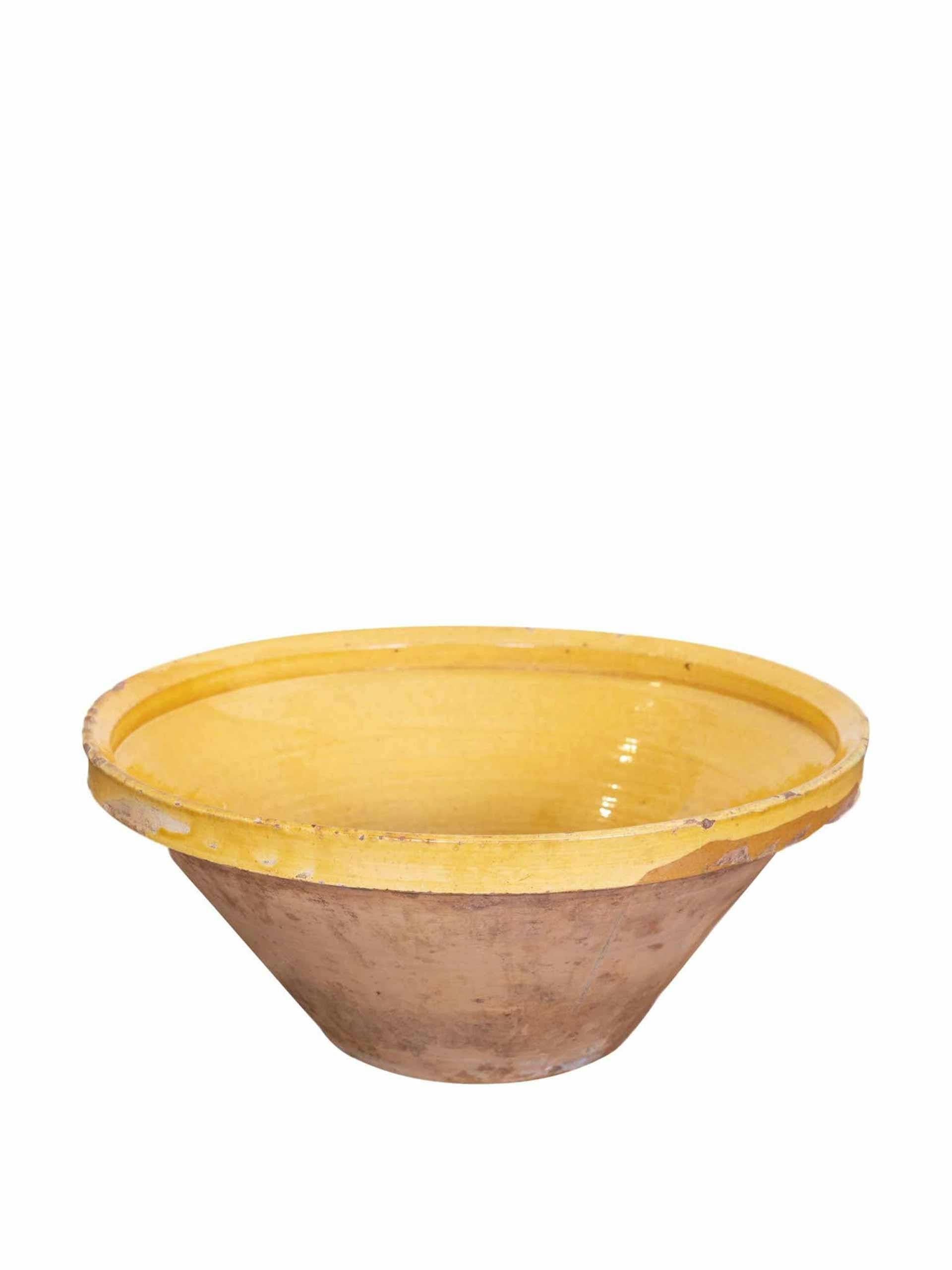 Terracotta bowl with yellow glaze