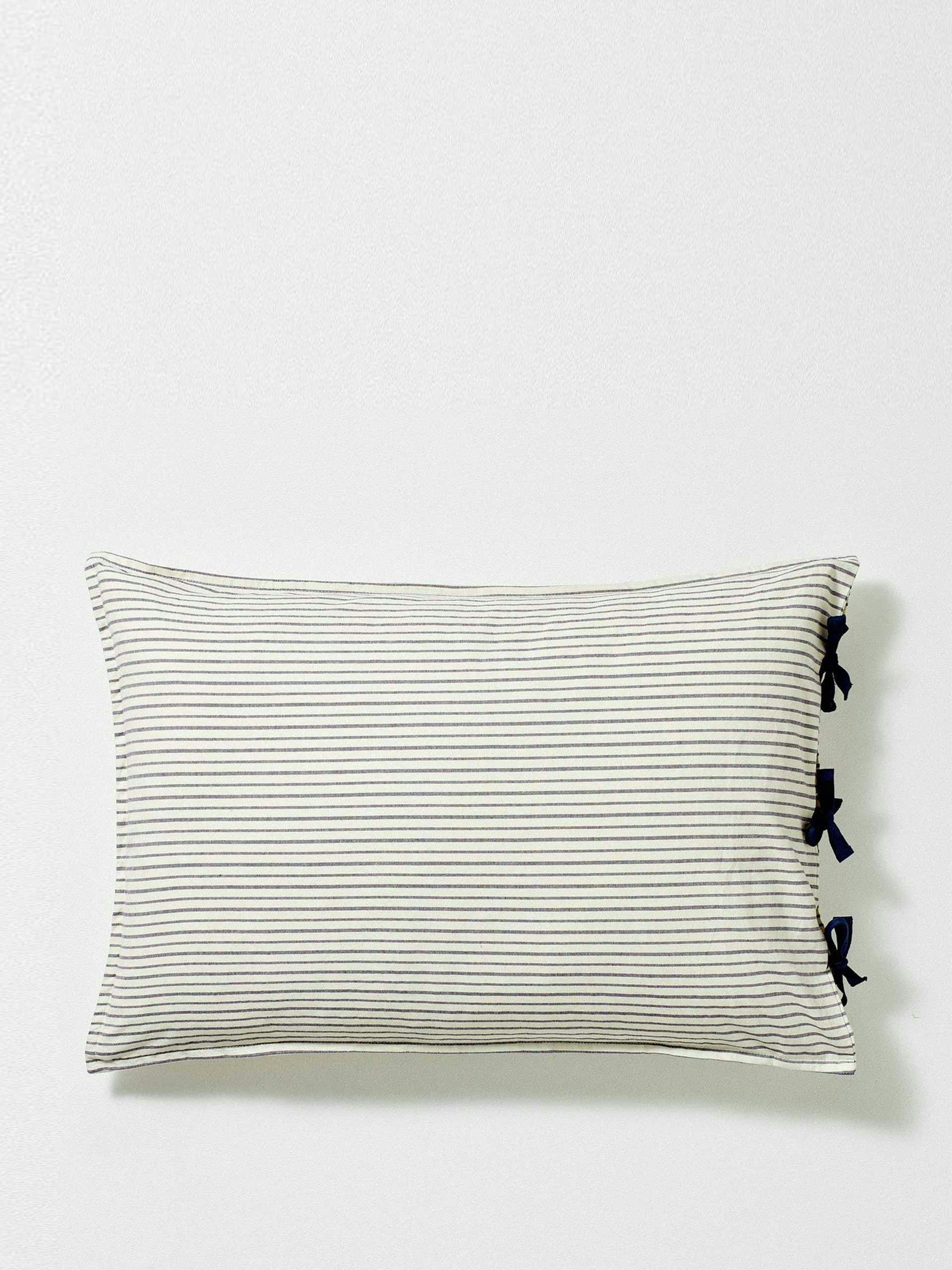Navy and white striped pillow