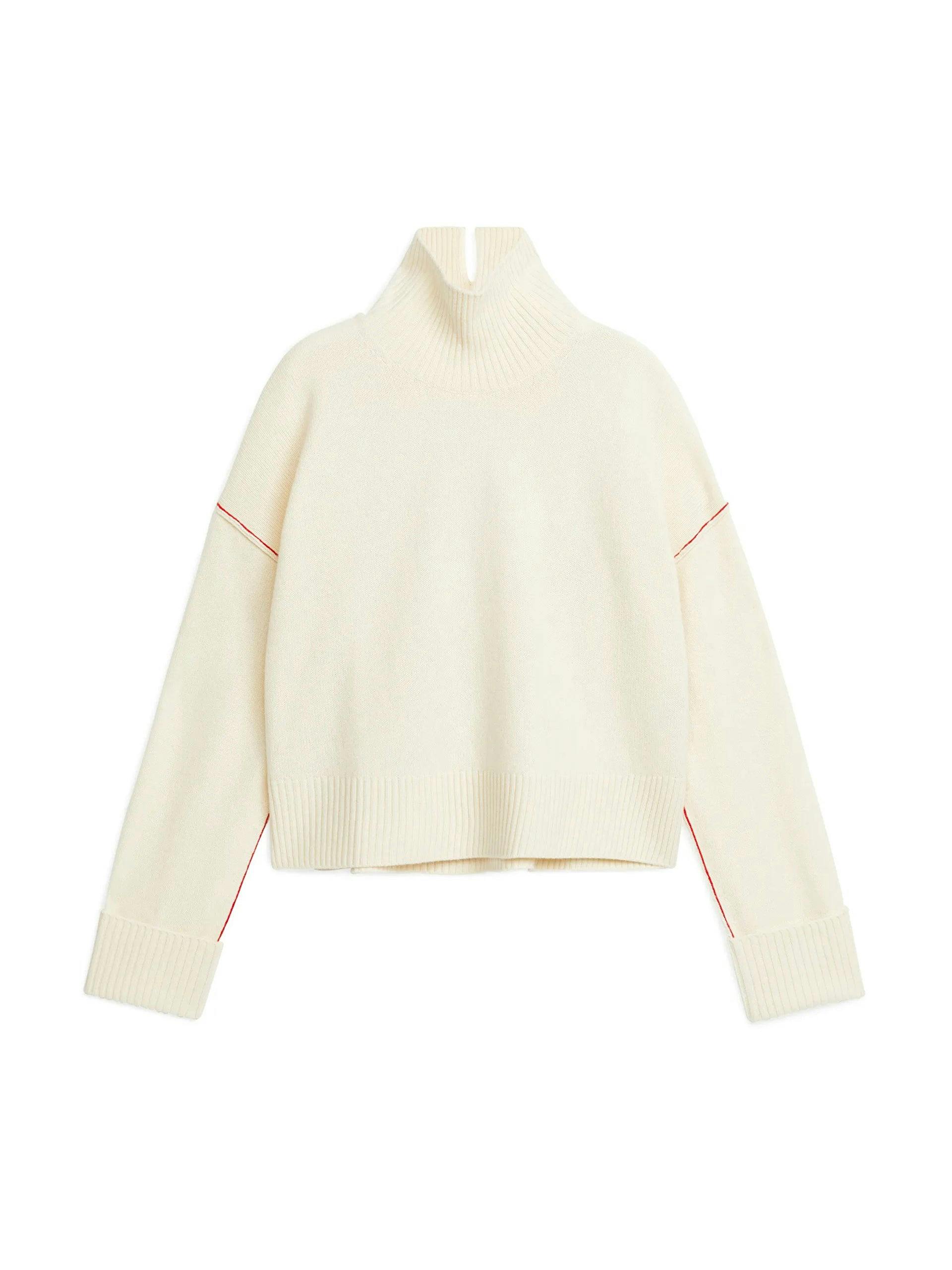 White wool jumper with red ribbed details