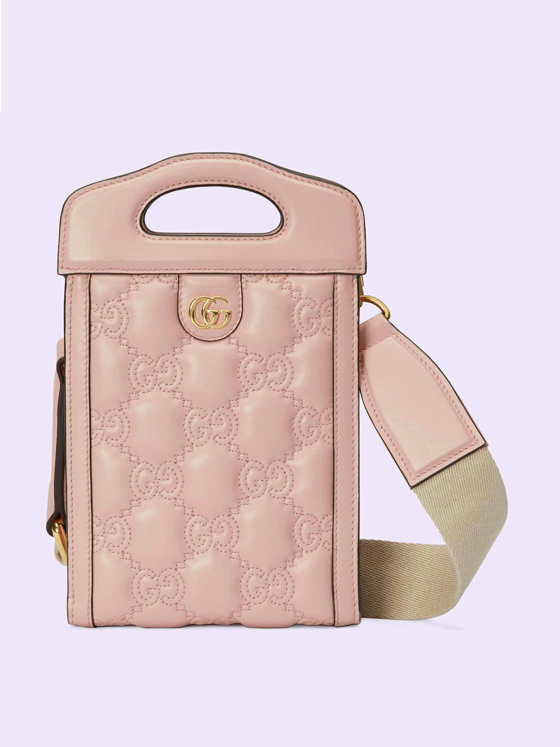 Pink embossed top handle mini bag