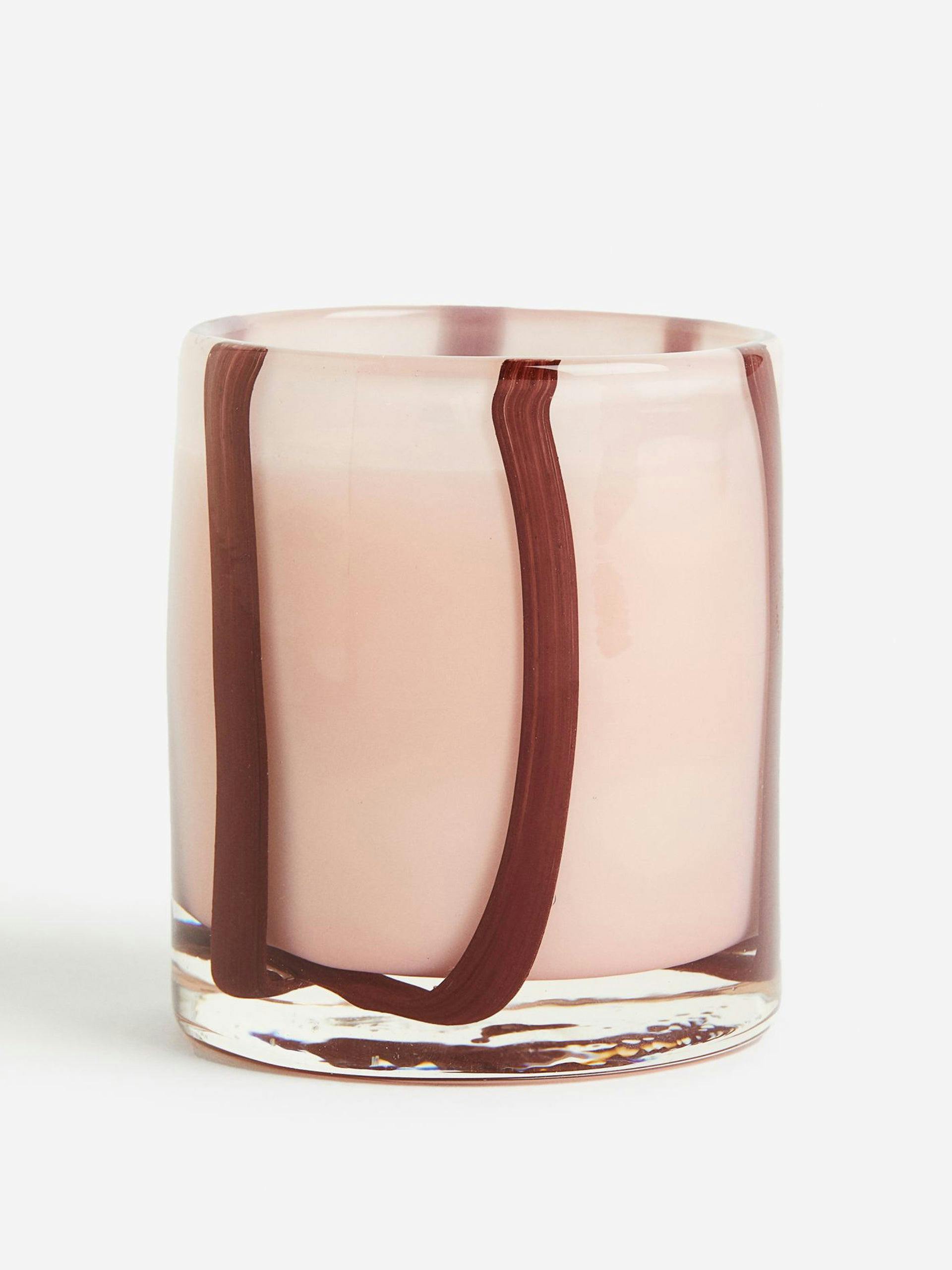 Plum Noir scented candle in striped glass holder