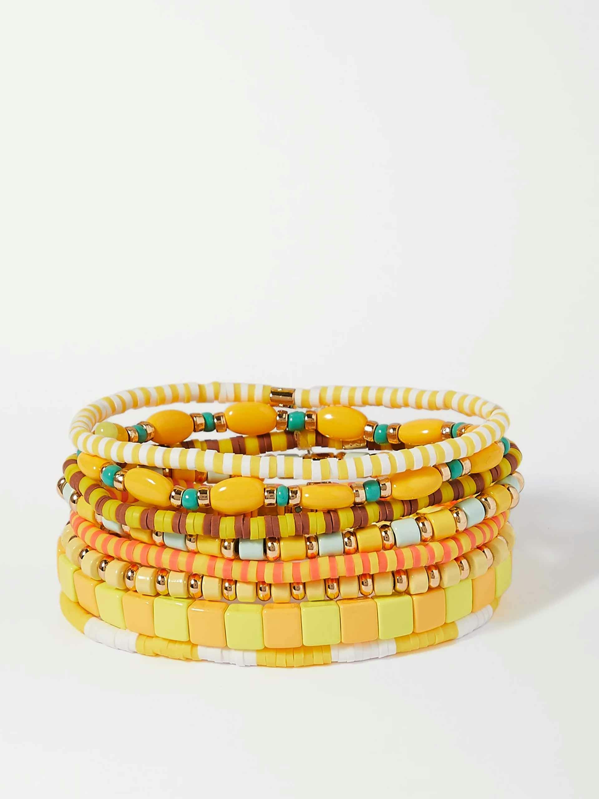 Yellow and gold-tone set of eight bracelets