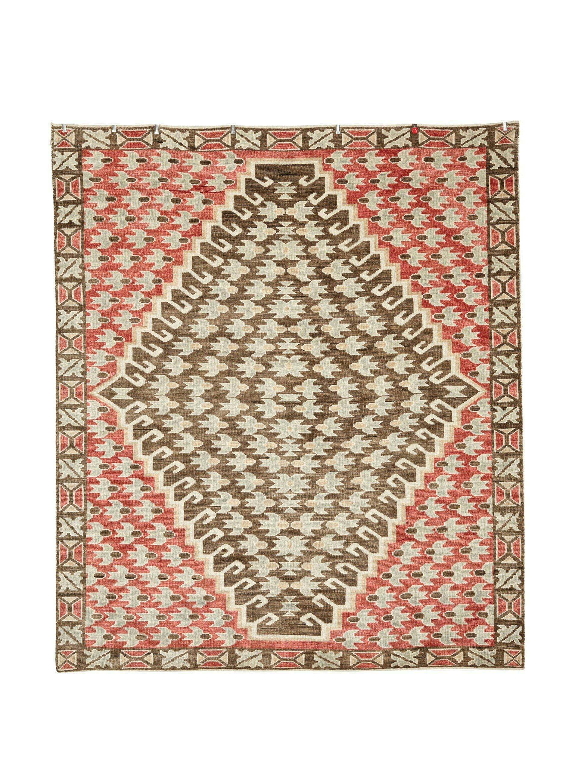 Hand-knotted geometric patterned rug