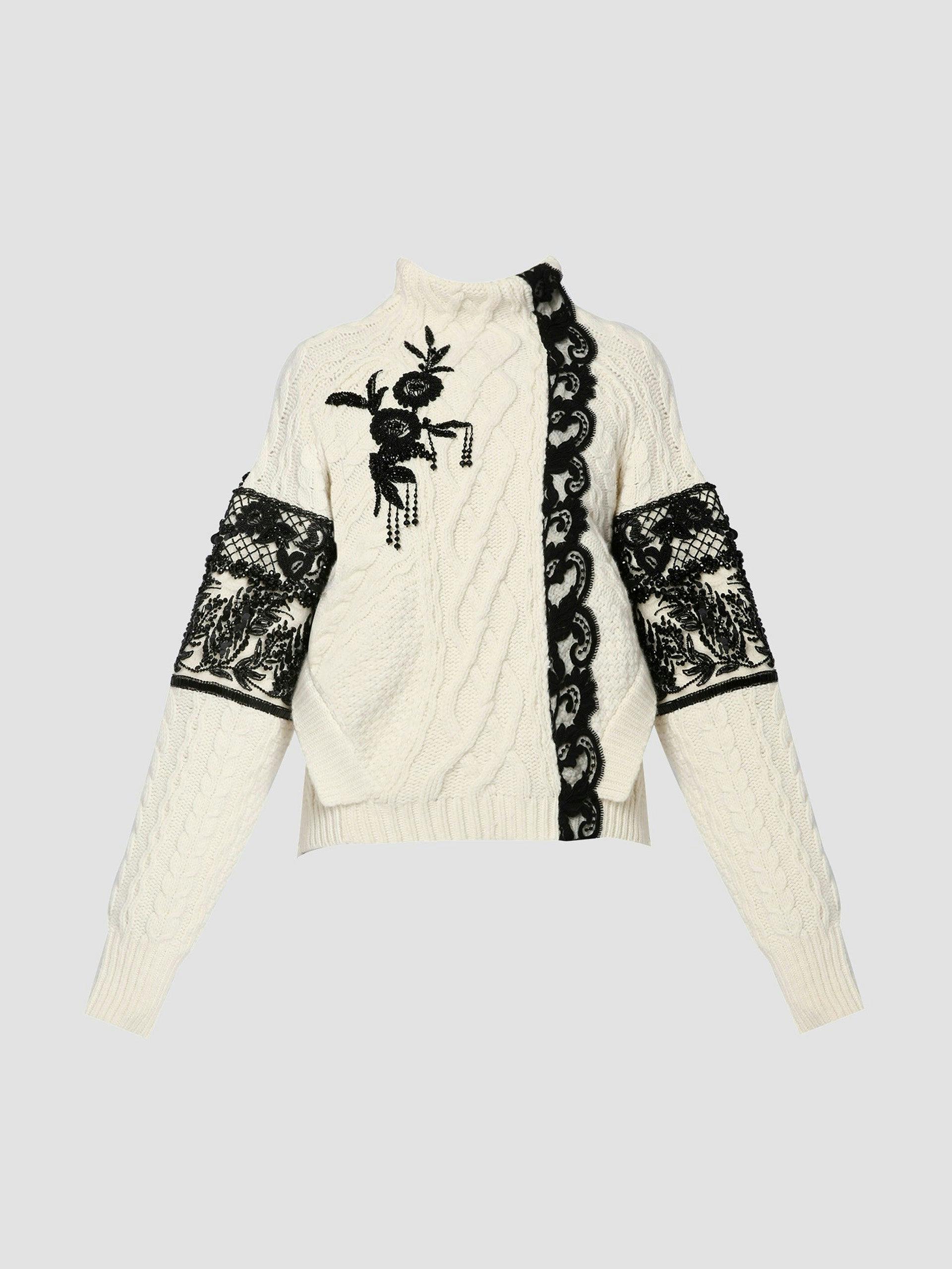 Hand-embellished, asymmetrical cable knit jumper