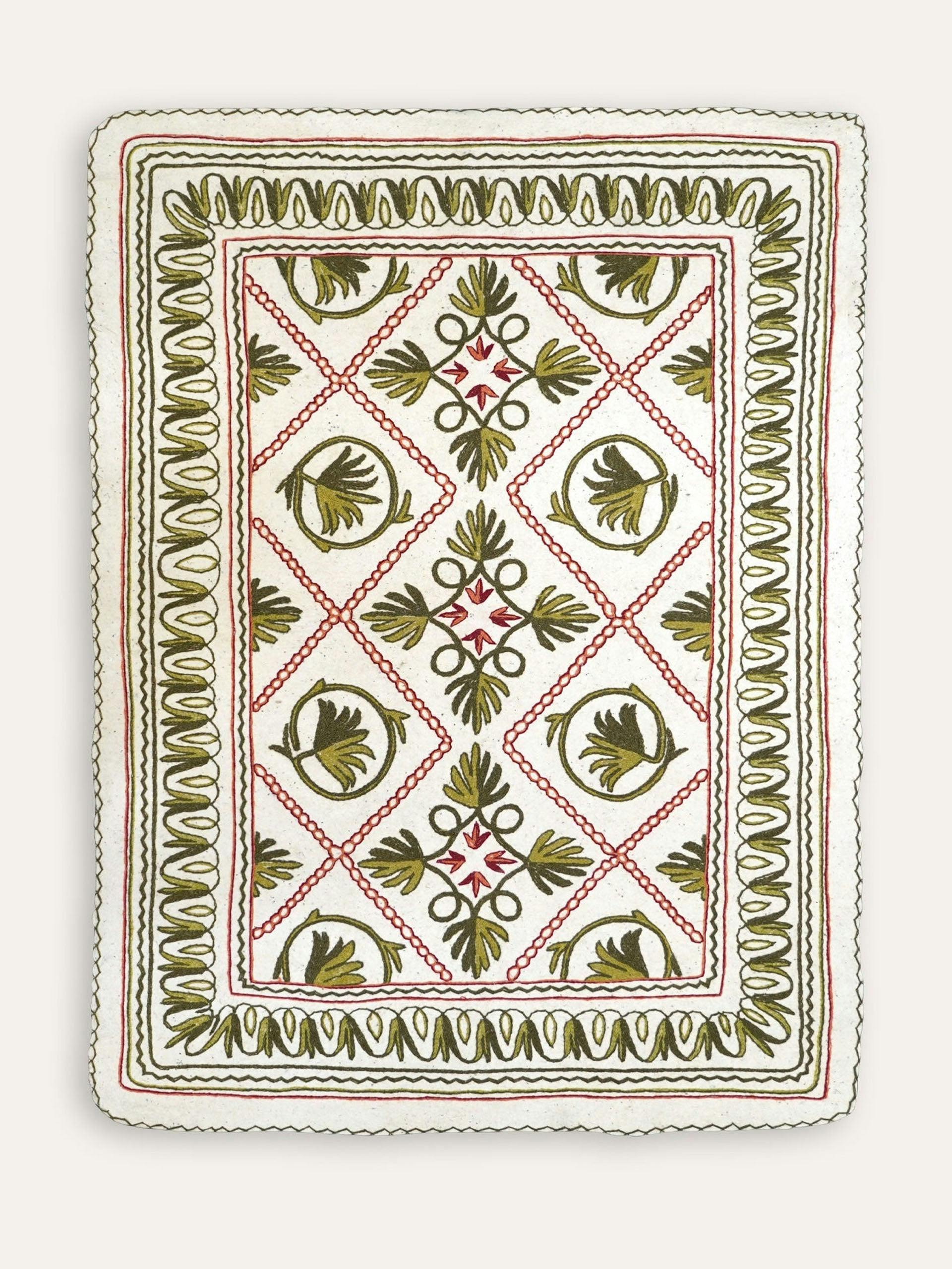 Green and pink Namda felt embroidered rug