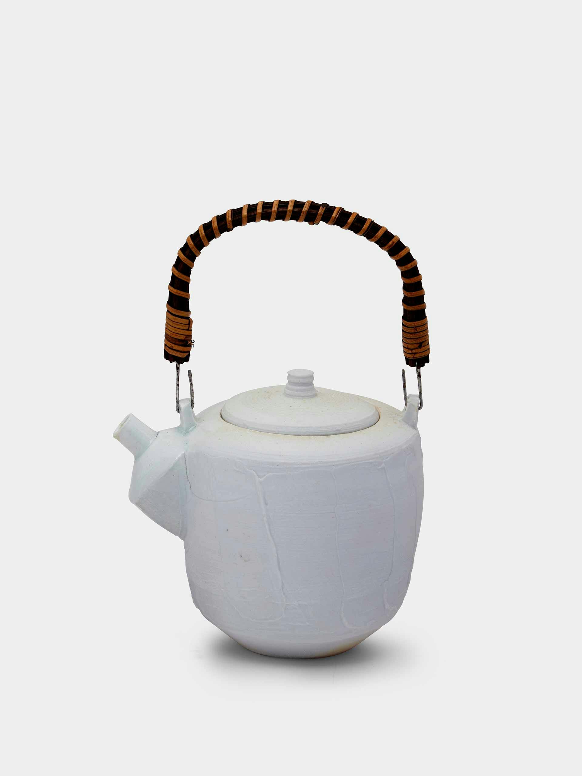 Porcelain teapot with wicker handle