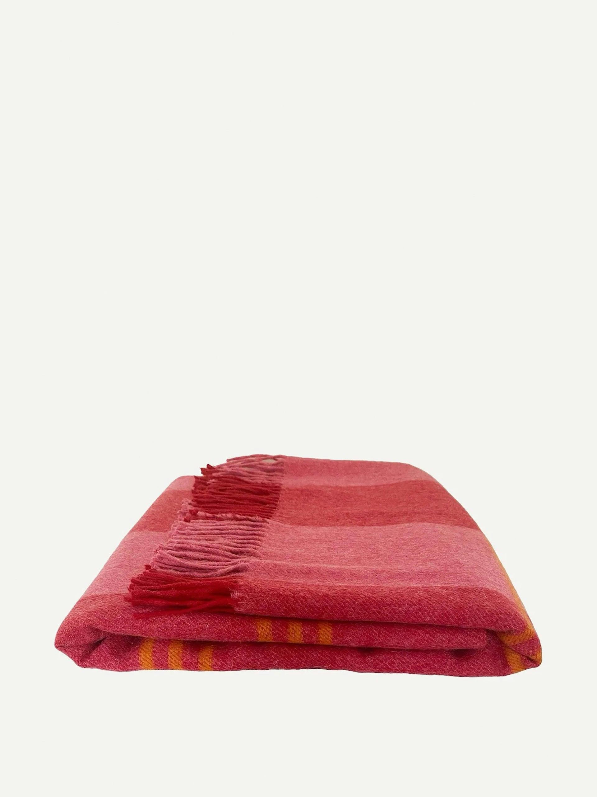 Pink and orange striped throw