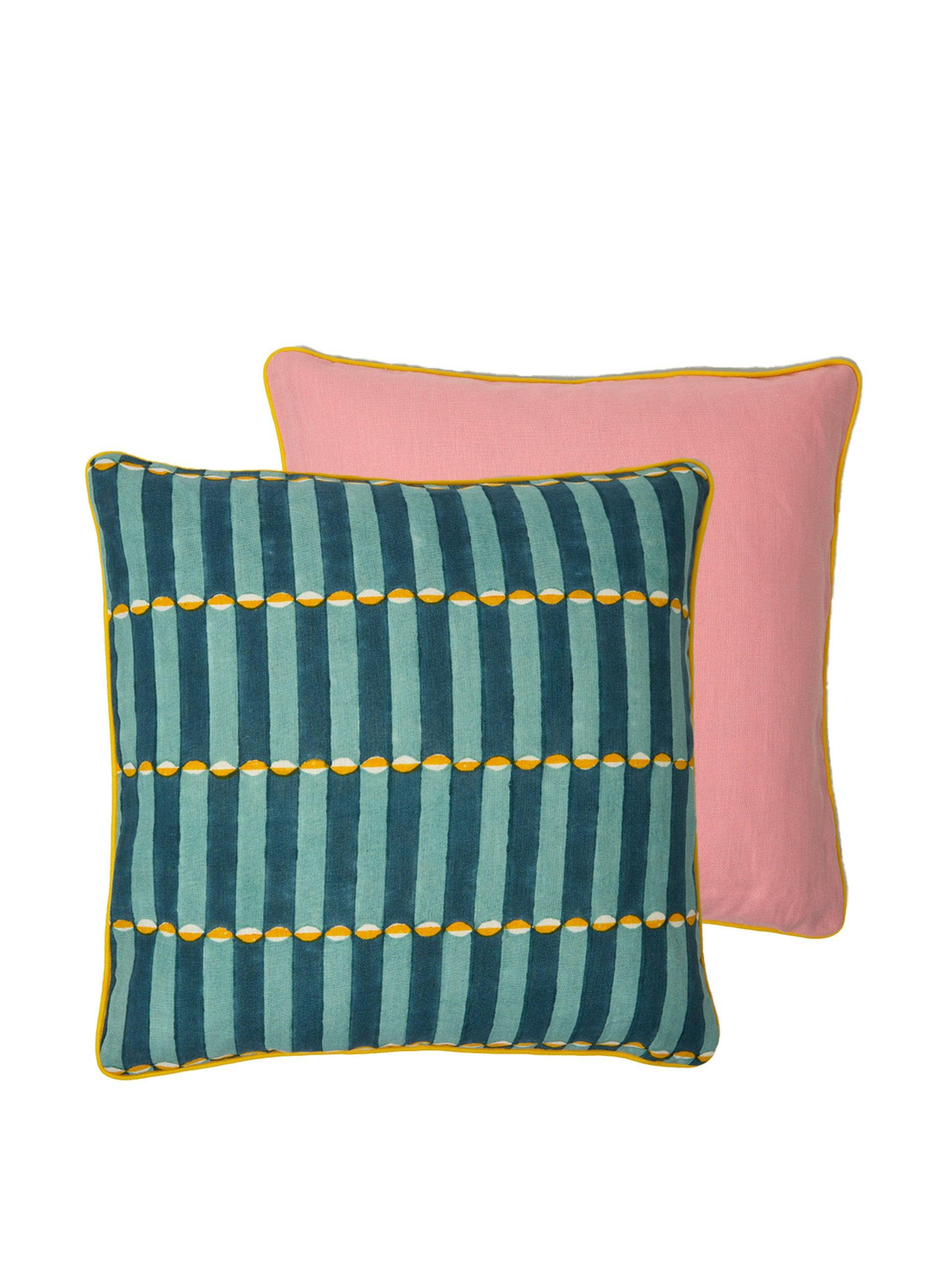 Contrasting cushion in Luna blue and Isabella pink with yellow piping