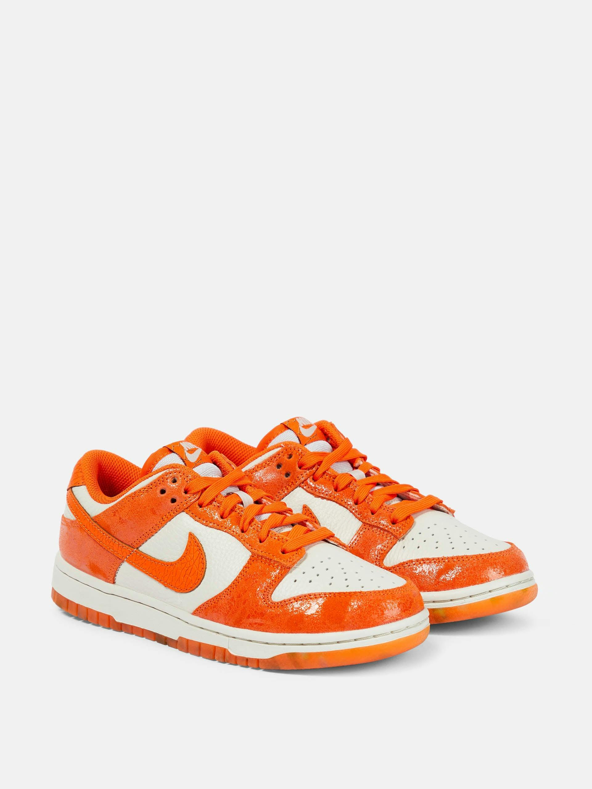 Dunk Low suede-trimmed sneakers in orange and white