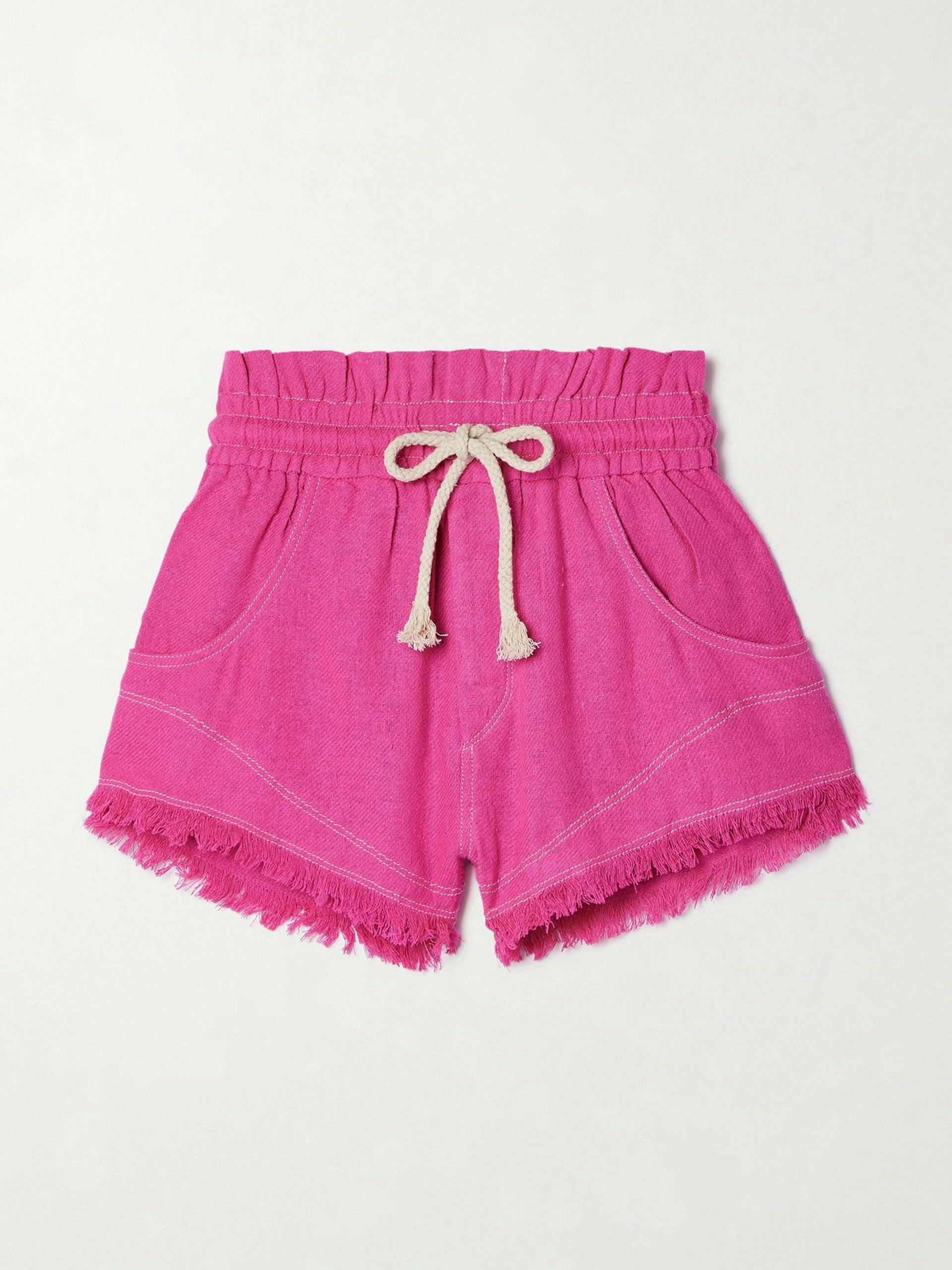 Bright pink frayed shorts