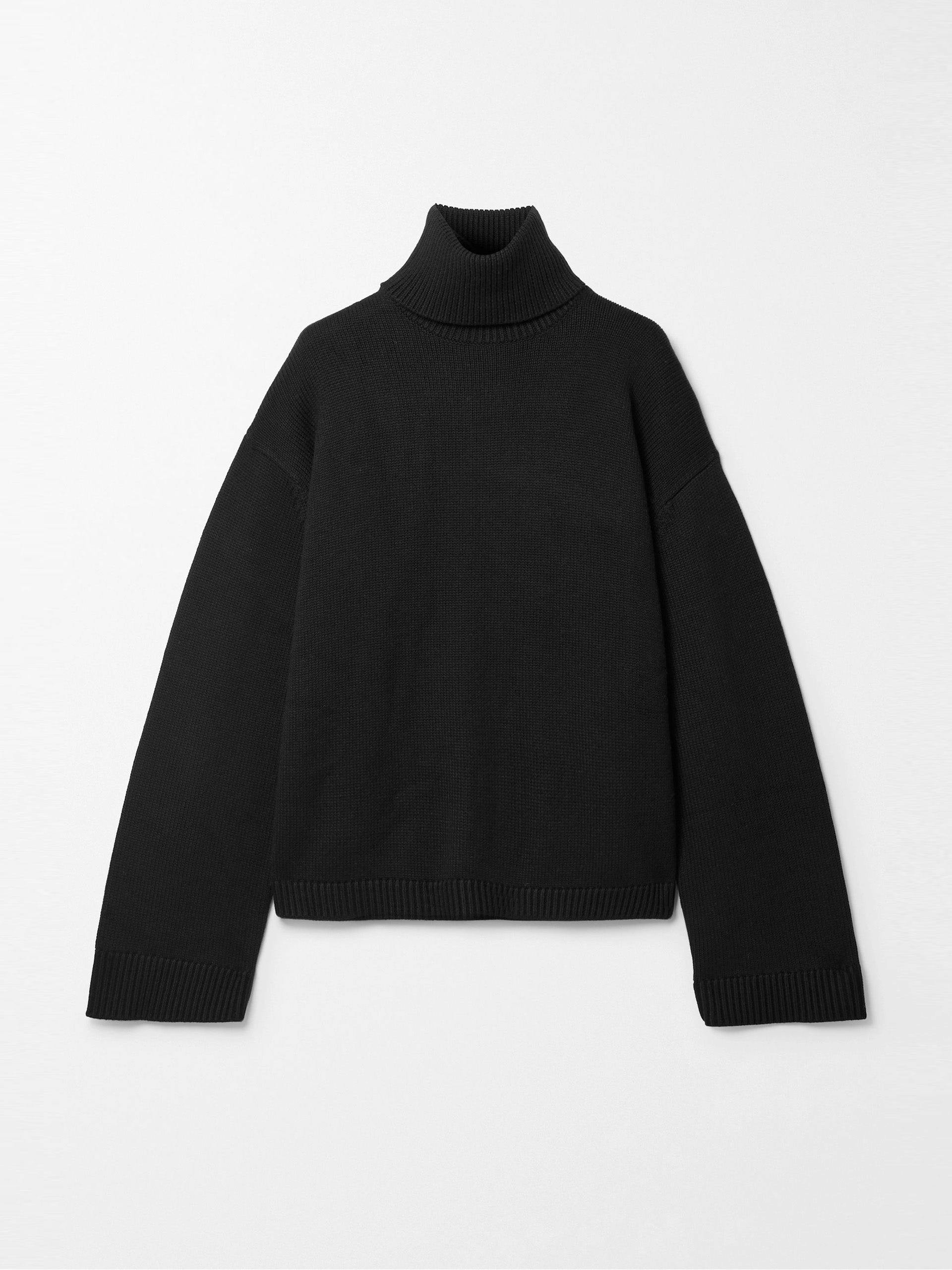 Black wool and cotton-blend turtleneck sweater