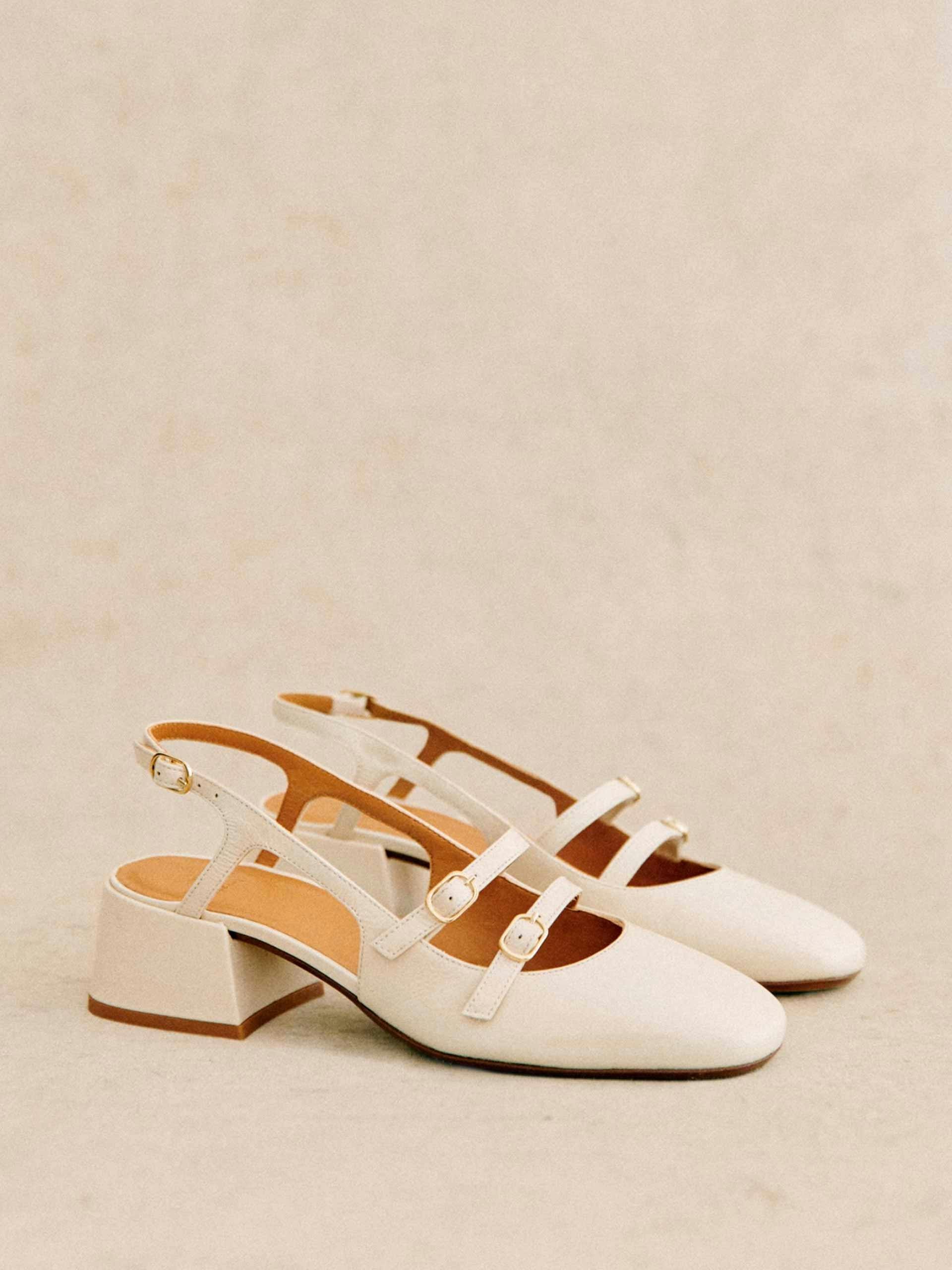 White patent leather buckled shoes
