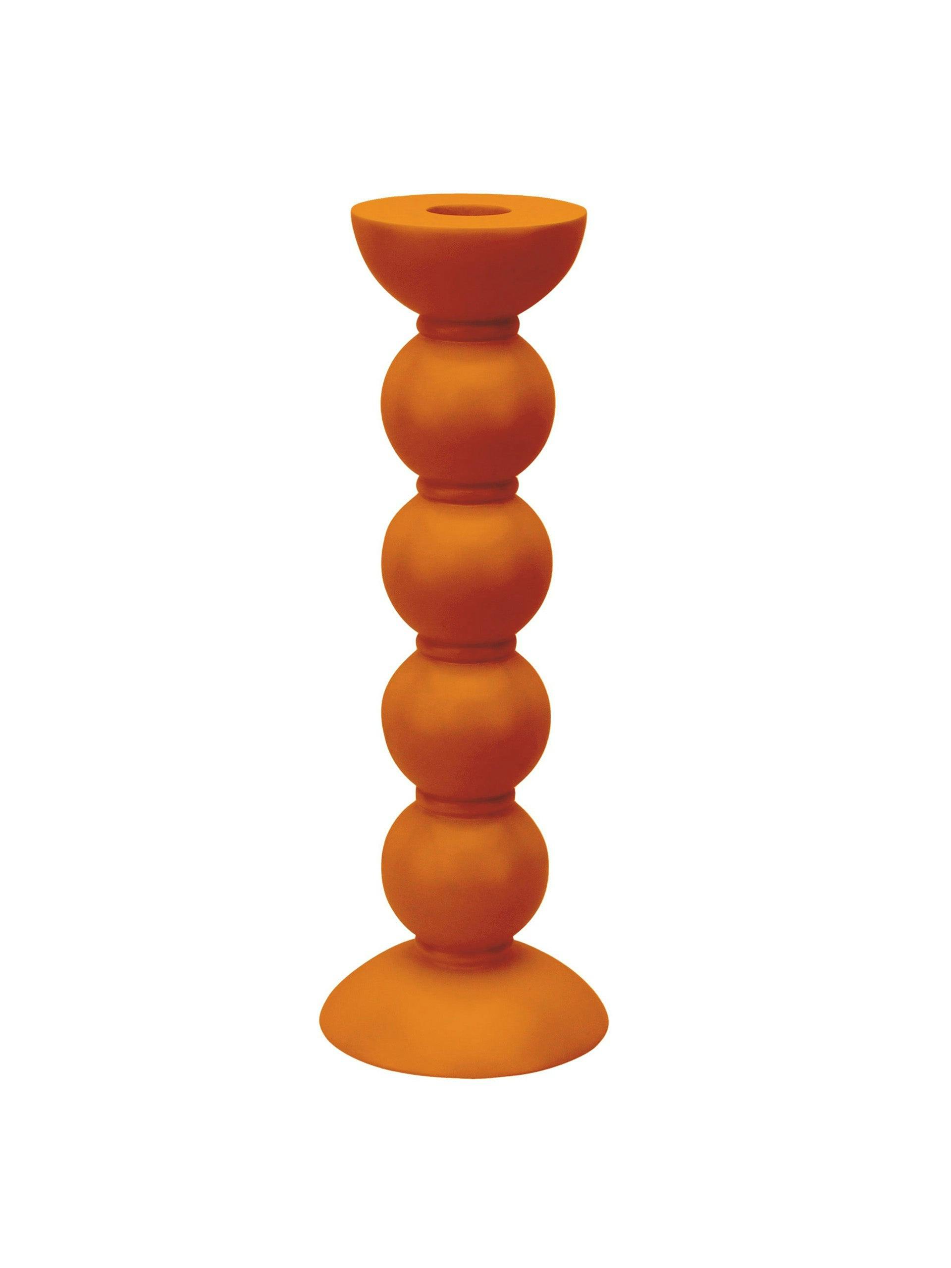 Tall orange bobbin candlestick
