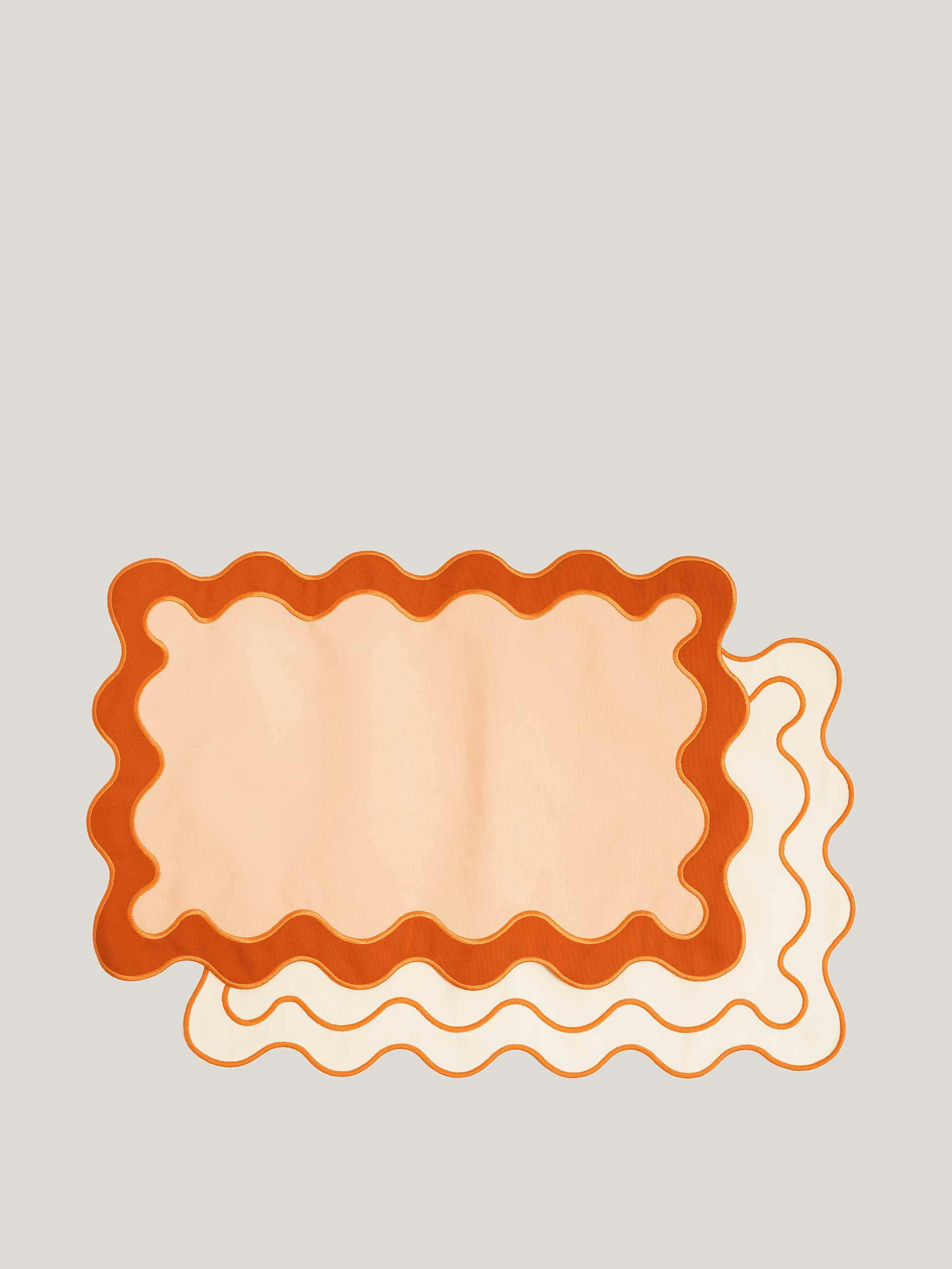 Orange scalloped placemats