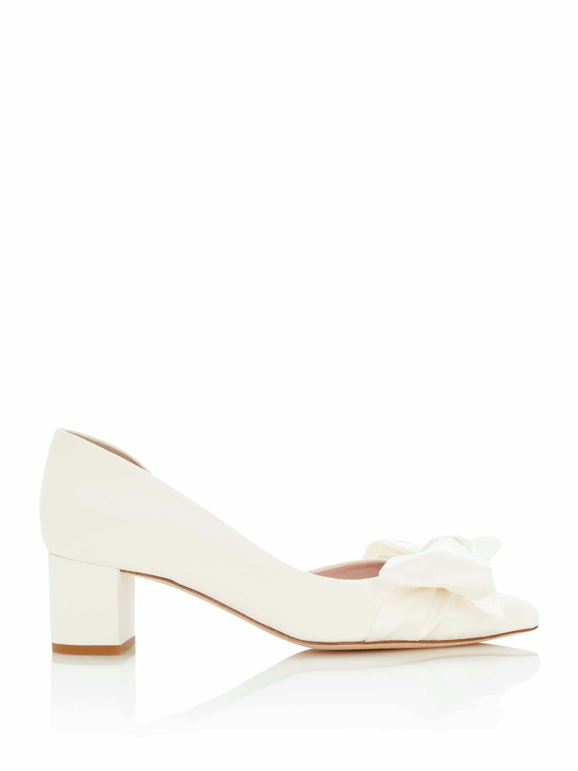 Ivory suede pumps with satin bow