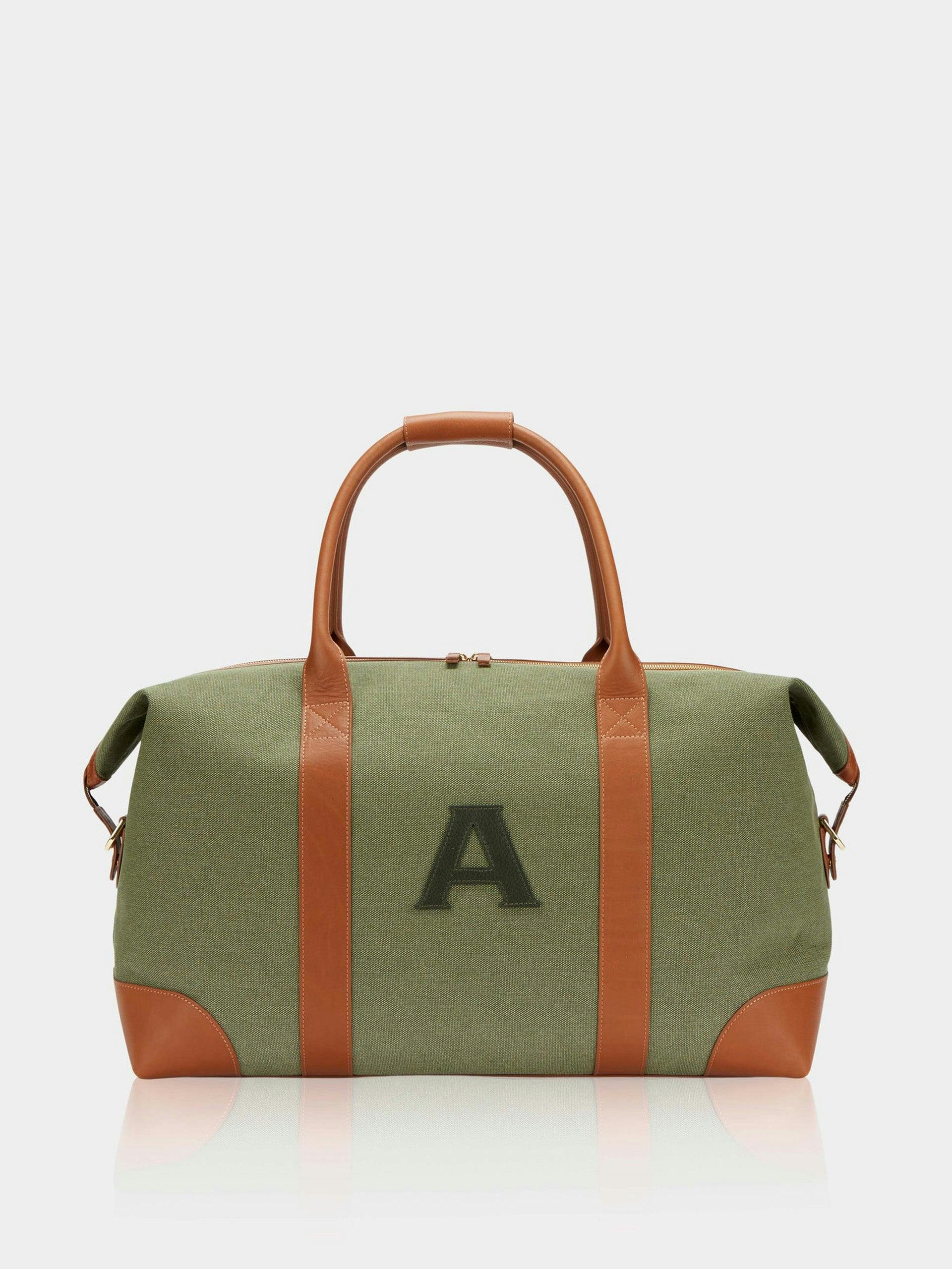 Canvas and leather weekend bag with initial detail