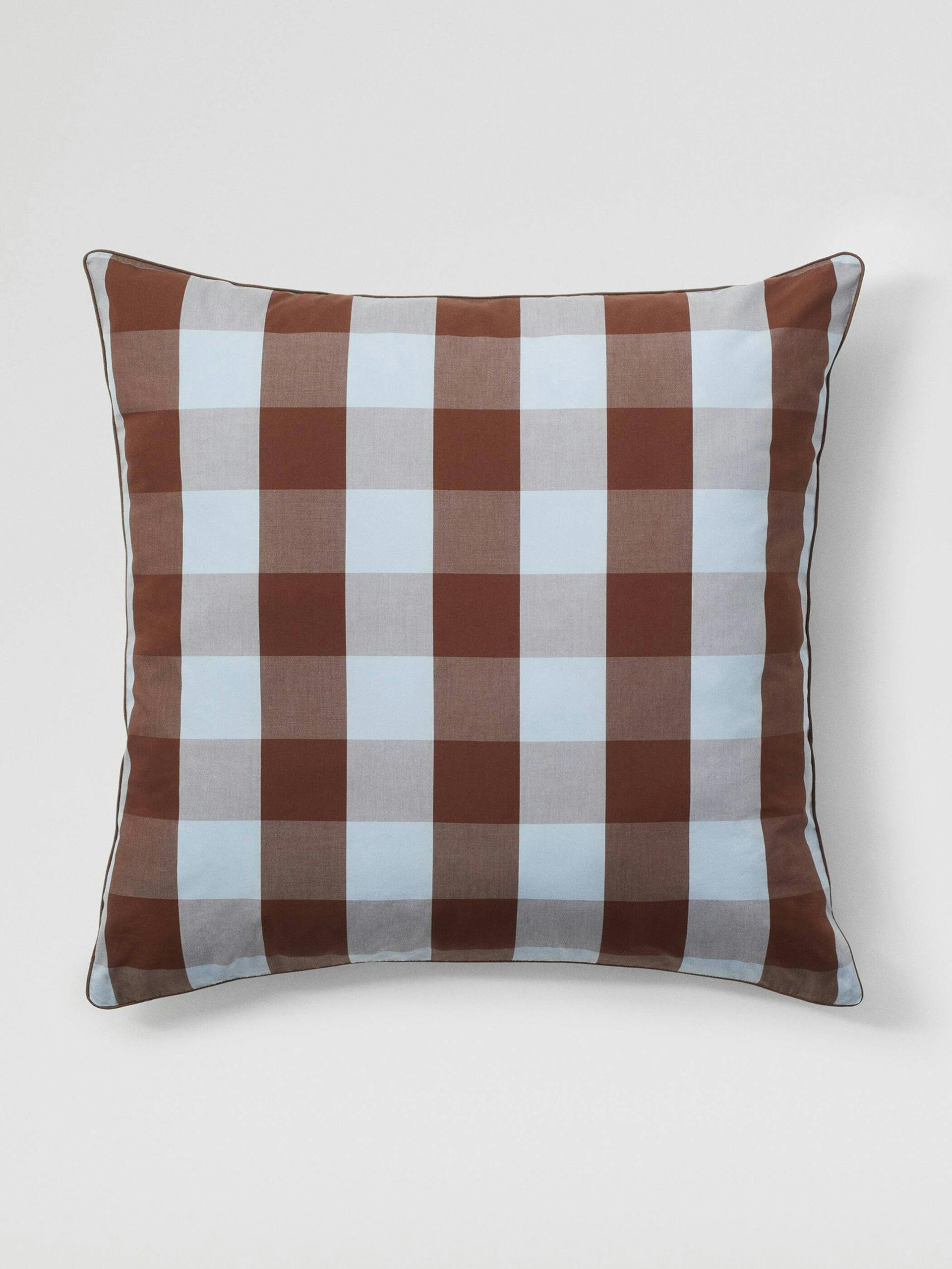 Brown and blue checkered cushion cover
