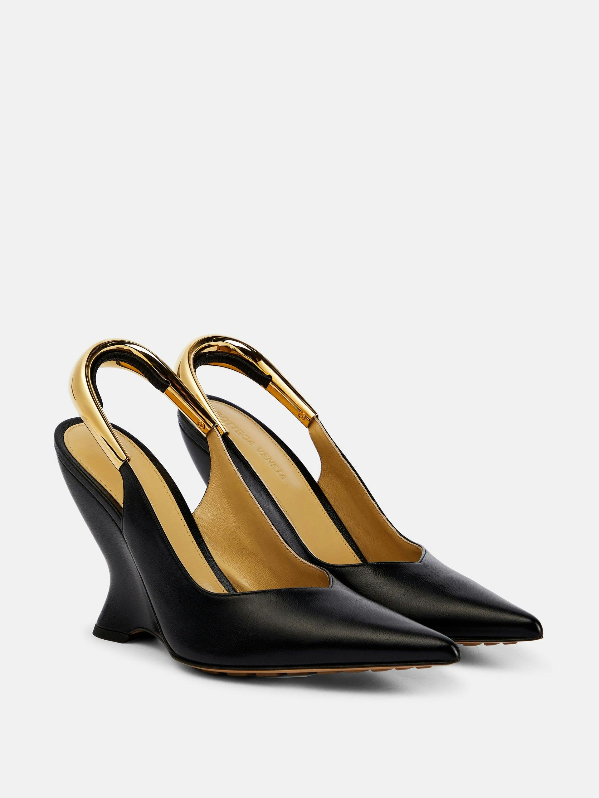 Black leather slingback pumps with gold metal detail