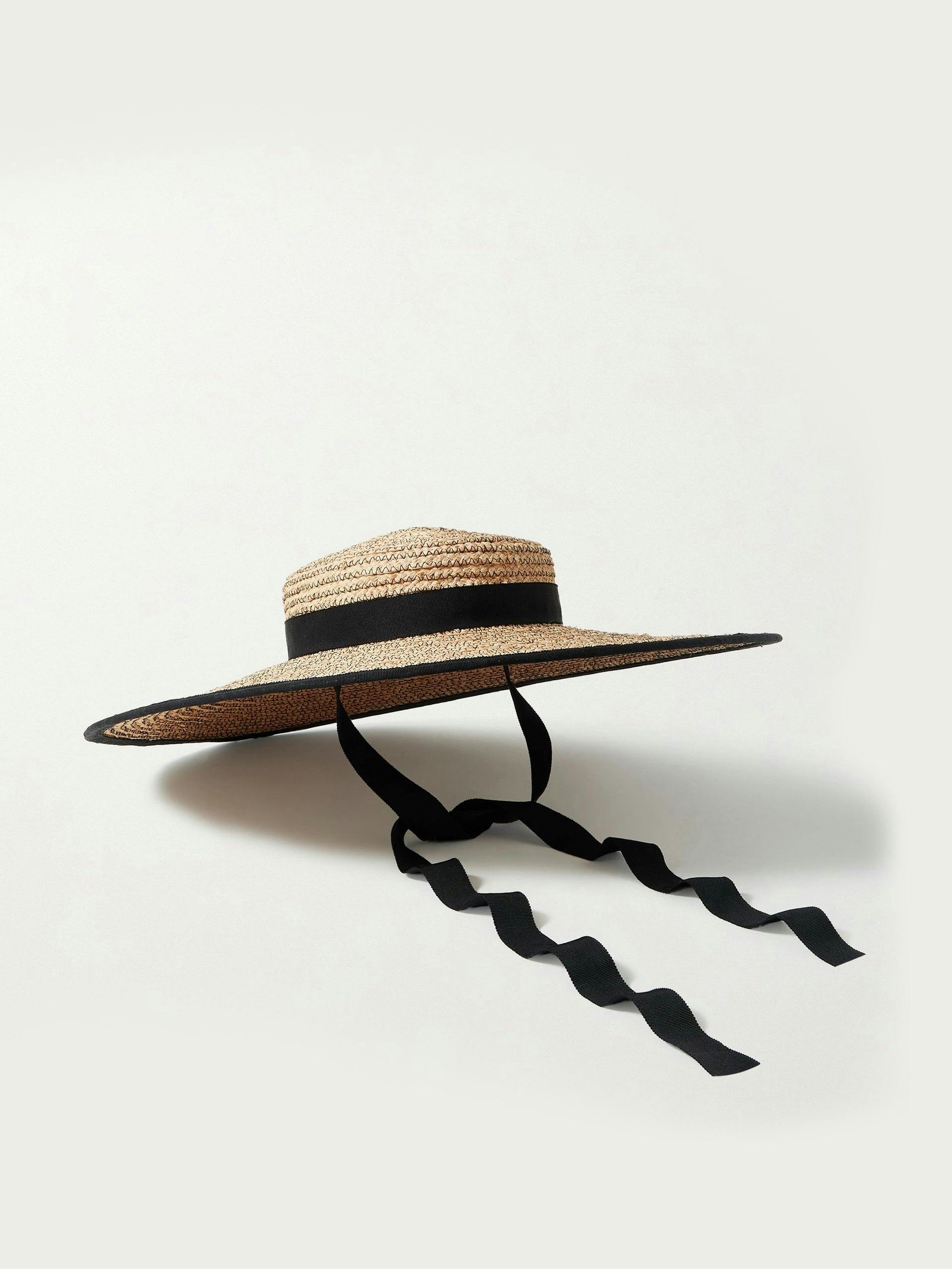 Straw hat with black trim