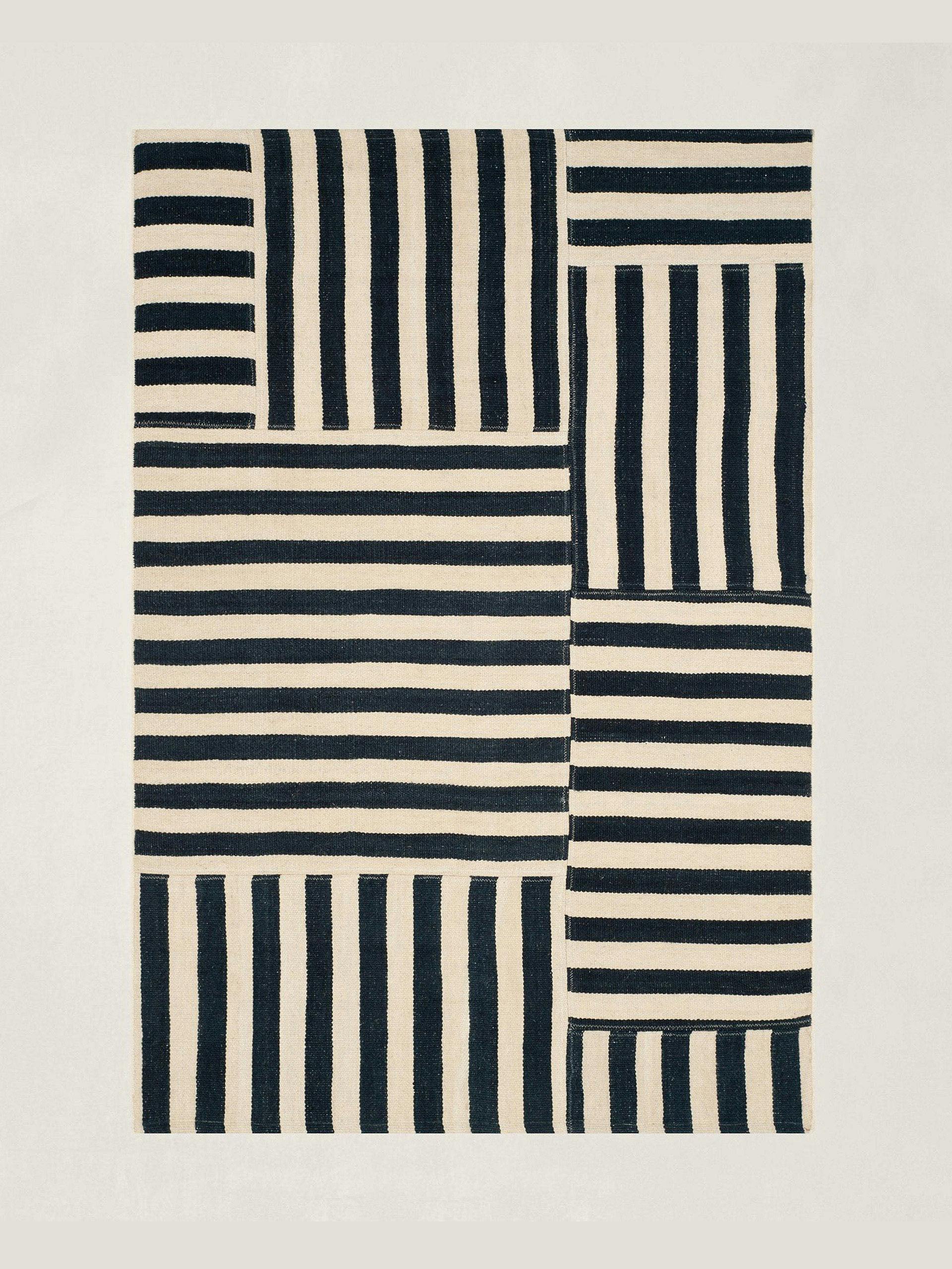 Flat-woven striped patchwork rug in cinder