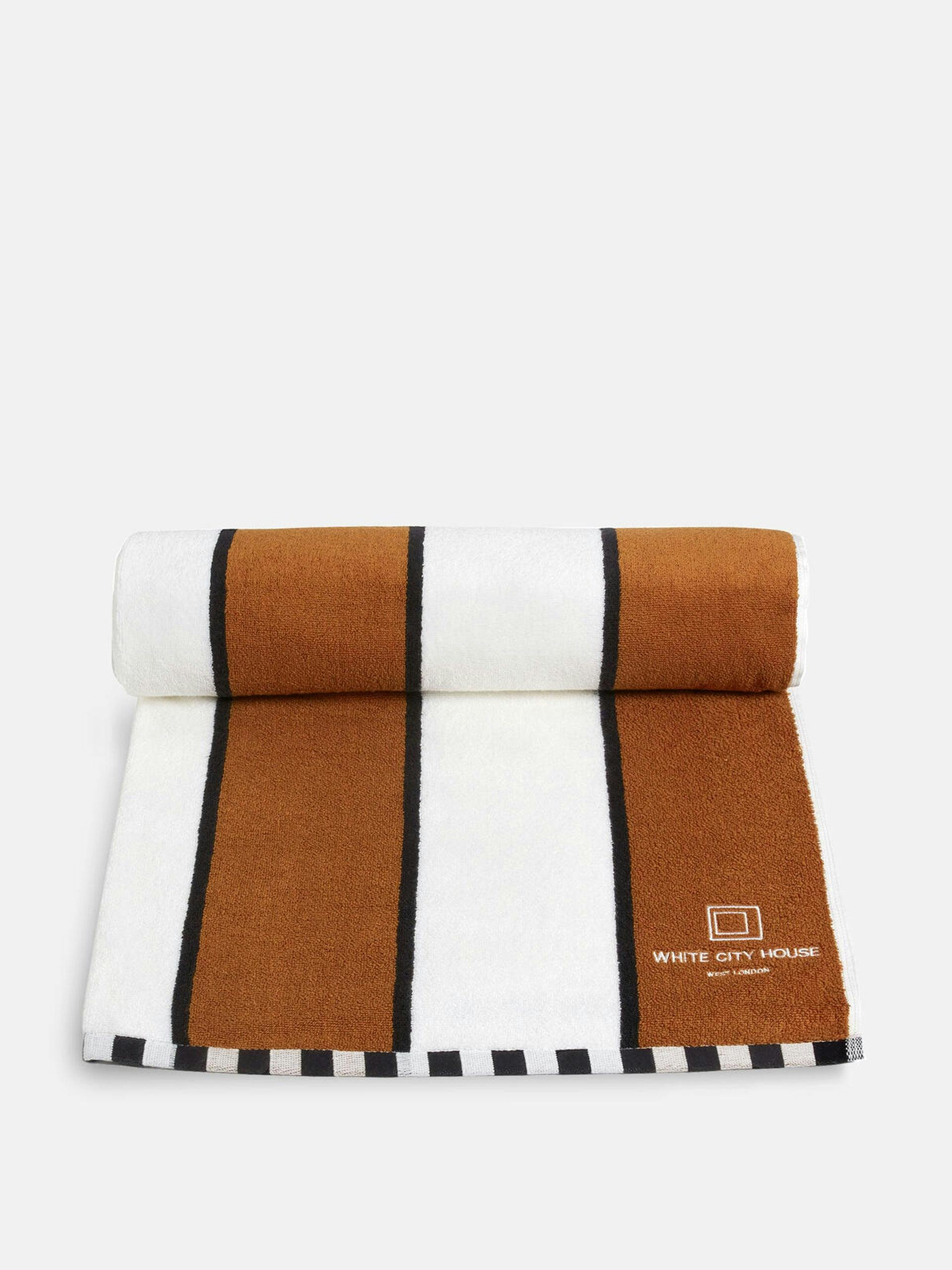 Brown and white striped pool towel