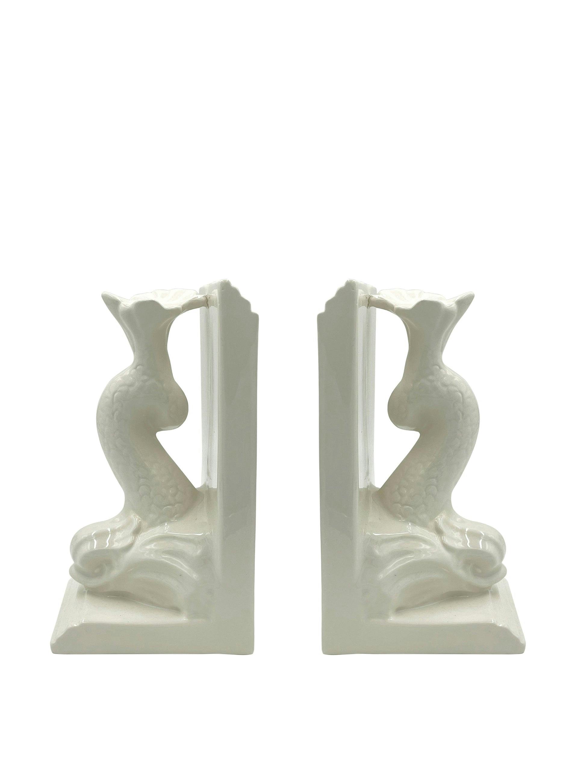Pair of dolphin bookends in cream