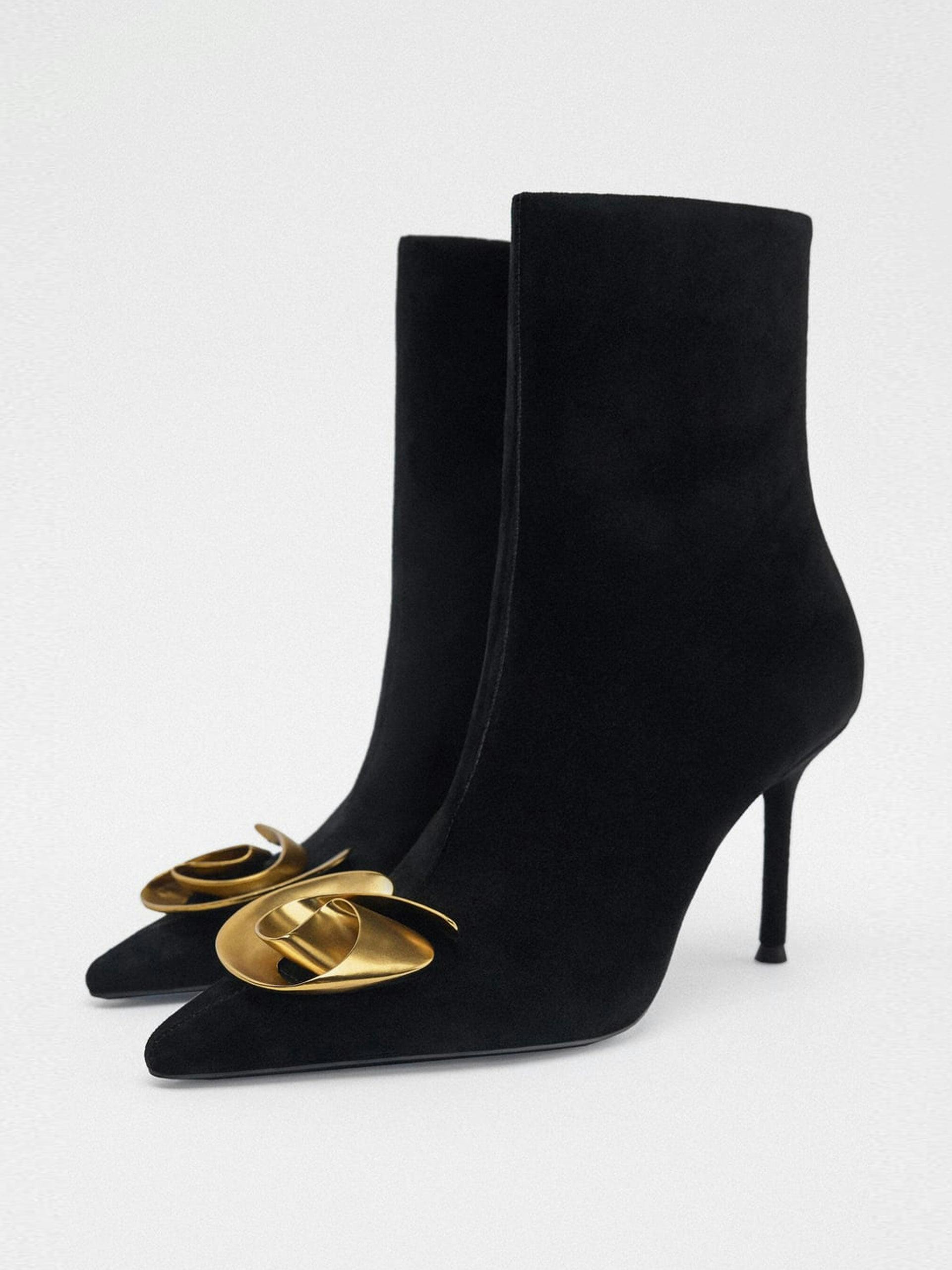 High-heel leather ankle boots with metal flower