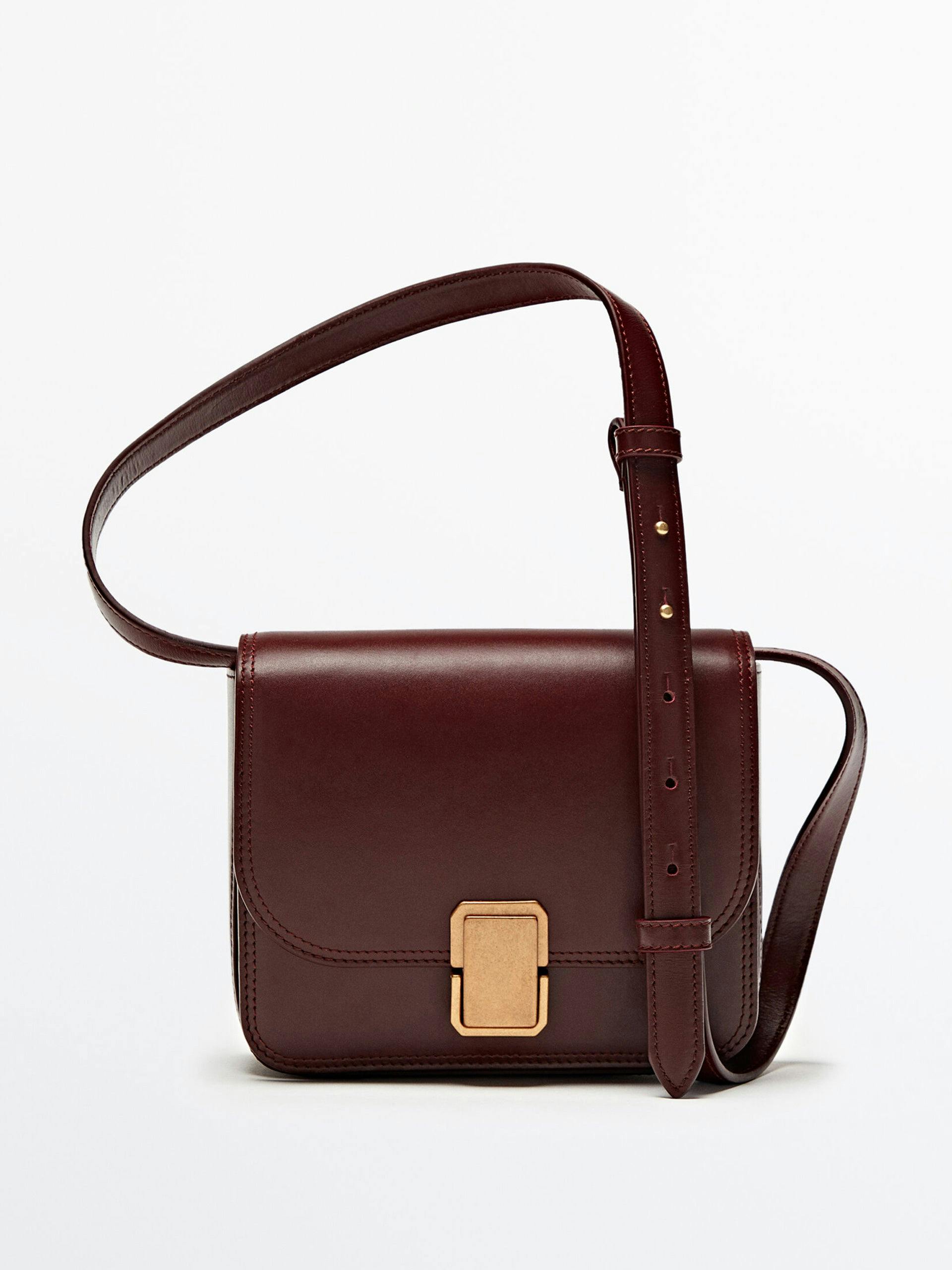 Leather crossbody bag with gold buckle finish