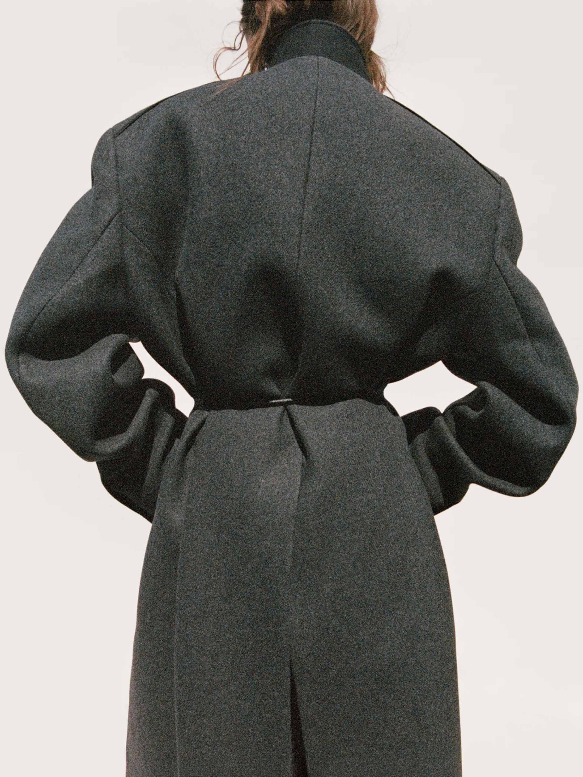 coats-holding-hm-studio